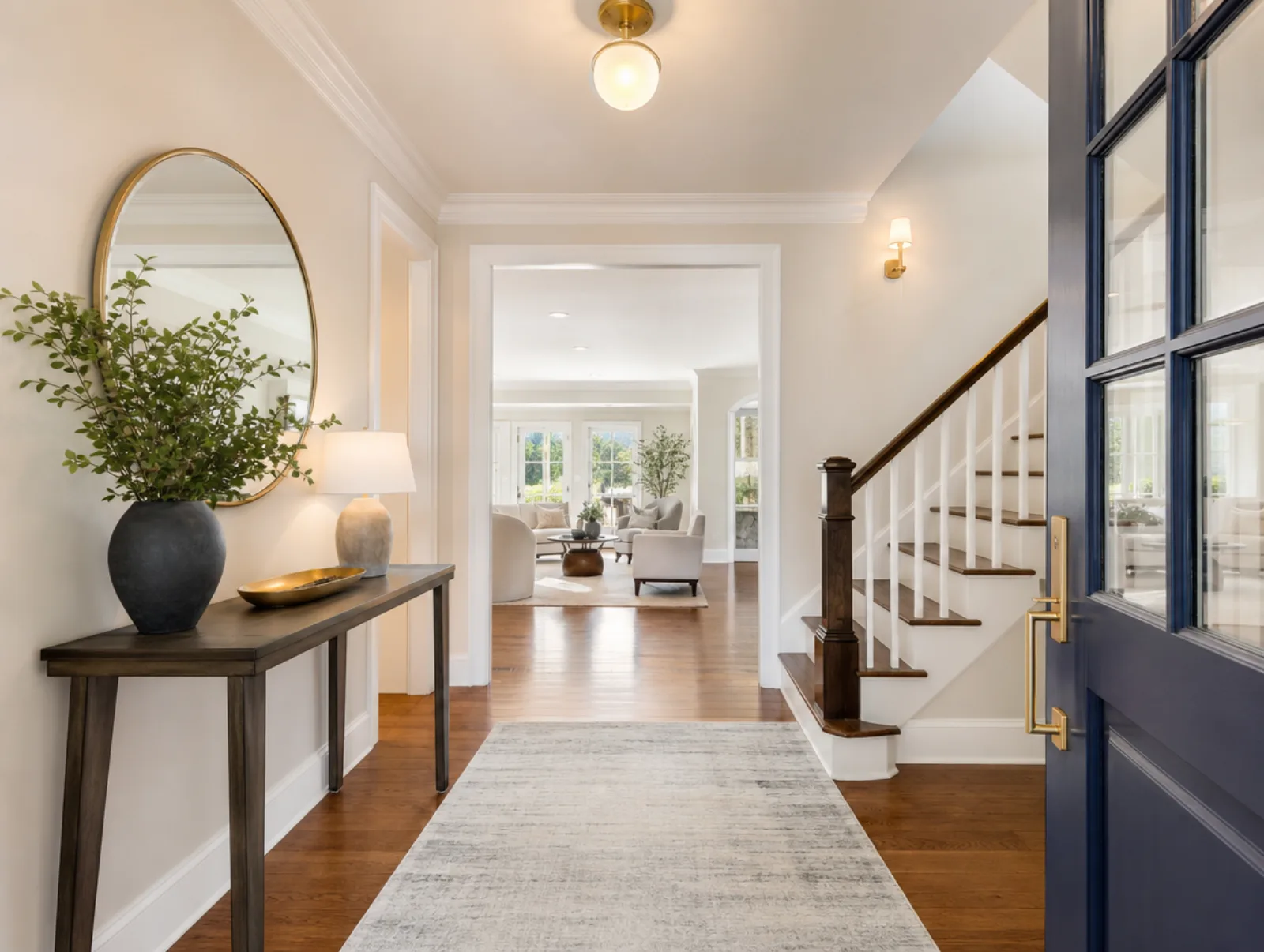Refreshed front door and landscaping on a dark-brick Metro Atlanta home before listing