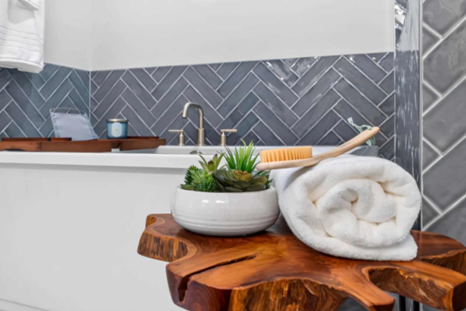 Staged bath detail with live-edge stool