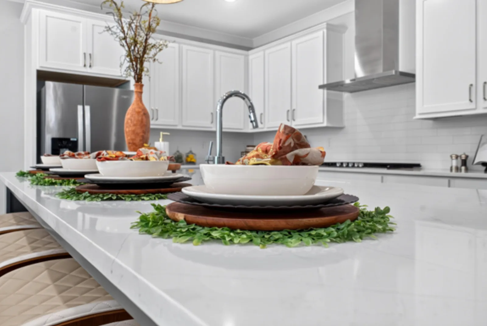 Staged kitchen island with place settings