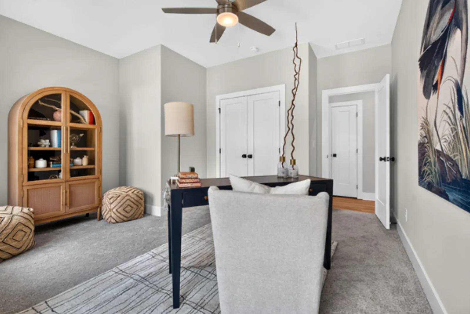 Staged home office with arched cabinet