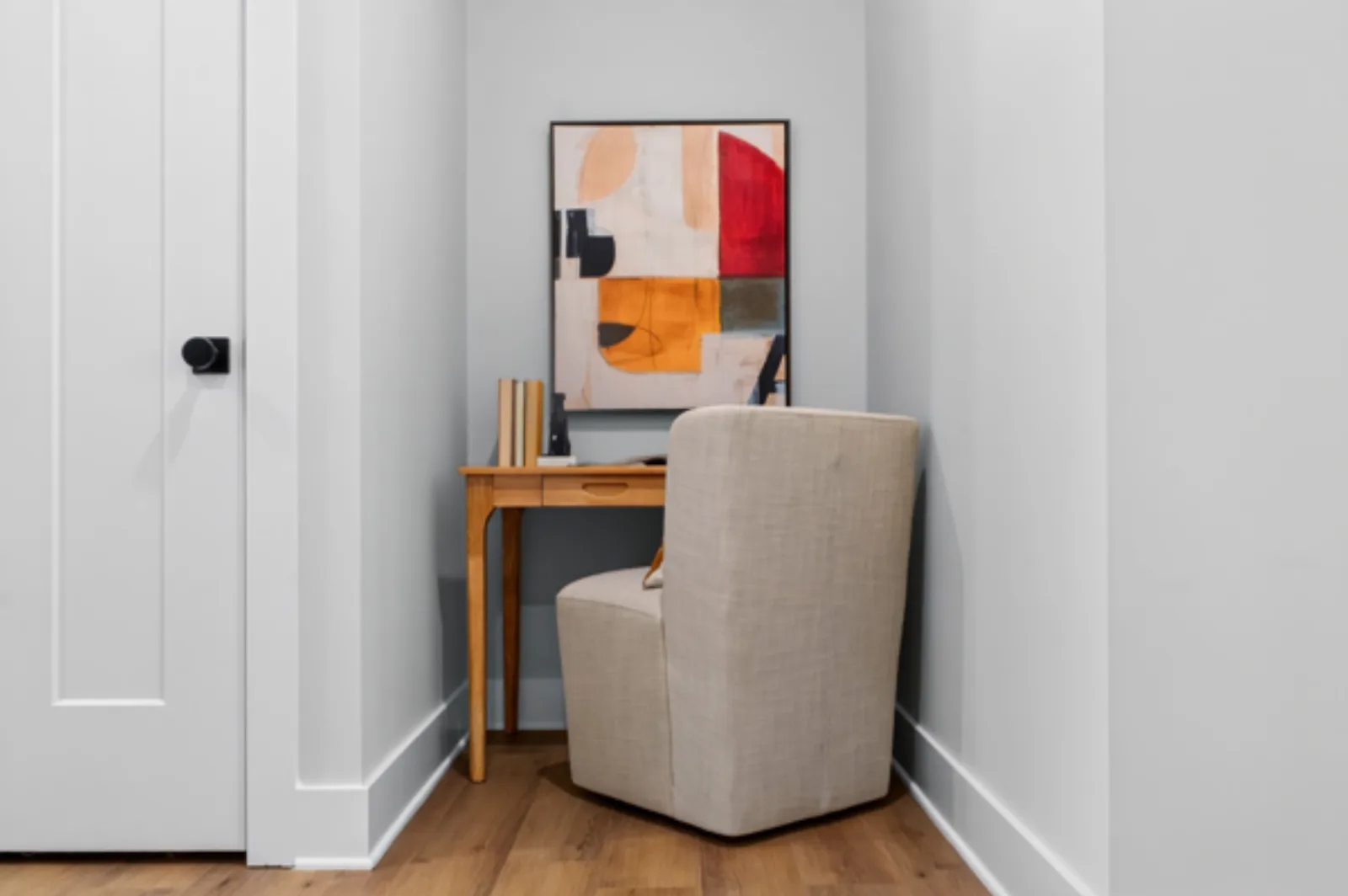 Staged reading nook with abstract art